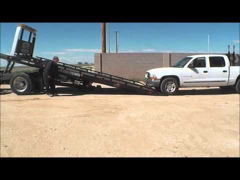 How A Flatbed Tow Truck Is Used - YouTube