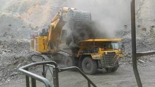 Komatsu Pc3000 Loads A Komatsu Hd785 Haul Truck And Kicks Up Dust
