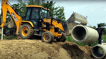 JCB Backhoe 3DX Lifting Heavy Culvert Pipe & installing in Drain - JCB Dozer