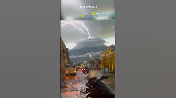 Thumbnail of Lightning appears to strike upwards from a volcano in optical illusion