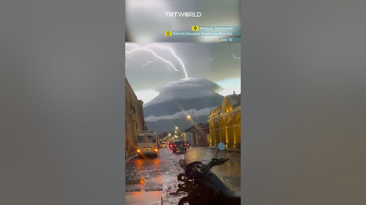 Lightning appears to strike upwards from a volcano in optical illusion