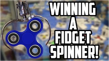 WINNING a FIDGET SPINNER from the MOST RIGGED CLAW MACHINE EVER!!