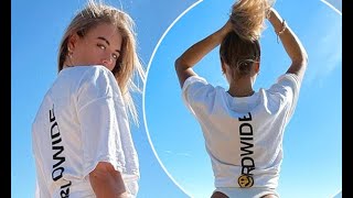 Love Island's Arabella Chi displays her peachy bottom in a thong bikini and a tie-up tee in wistful