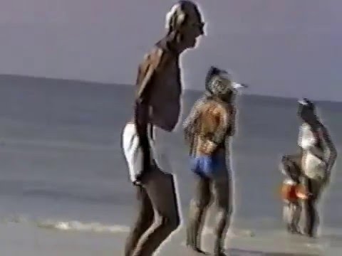 Grandmother Having Fun On The Beach