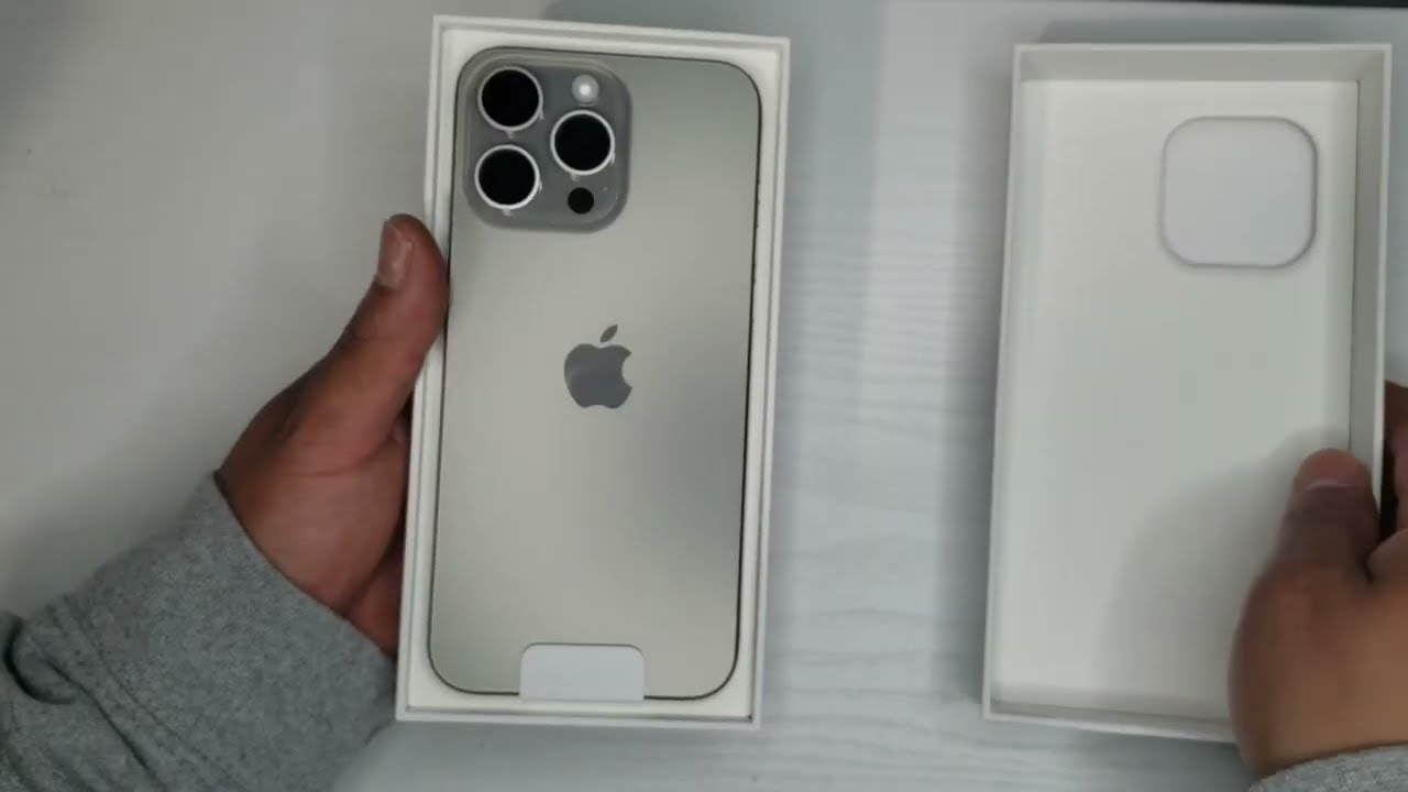 Unboxing iPhone 15 Pro Max box in Natural Titanium color - (Mention  @zana_qaradaghy on Instagram while use this photo) Follow on Instagram  @zana_qaradaghy · Free Stock Photo