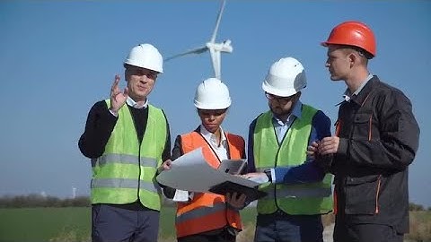 Four Engineers Discussing A Blueprint Stock Video