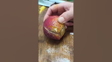 The process of cutting plums with a knife