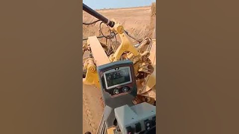 Caterpillar grader slope cutting
