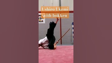 Ushiro Ukemi with bokken in Aikido (rear view)