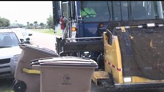 Trash company refusing to pay fines over automated pickup service