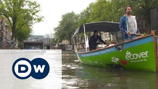 По каналам Амстердама - на лодках из мусора