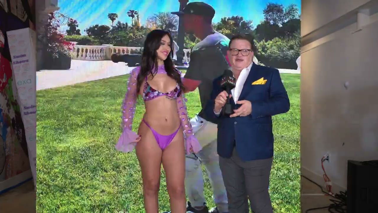 Model Ashley interviews at Exa Shows Art Basel Miami wearing Capristan