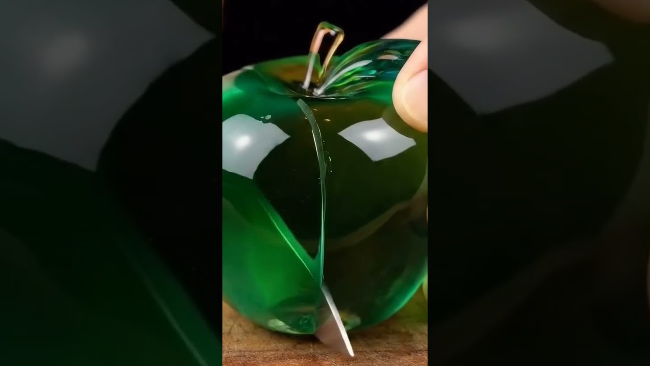 green crystal apple to cut with a knife 