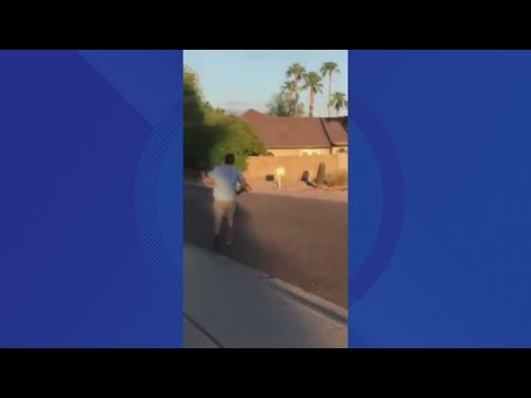 Coyote carries dog down Scottsdale street