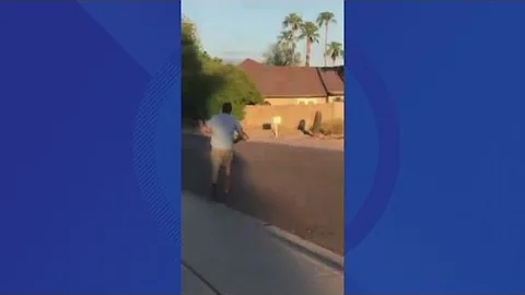 Coyote carries dog down Scottsdale street
