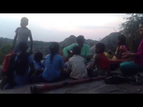 Gali and the kids singing on the boulders, Hampi, India