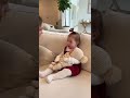 The mother slowly reaches her hands toward the newborn, smiling softly. The toddler #floppybaby