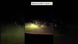 Mysterious Men In  Suits 