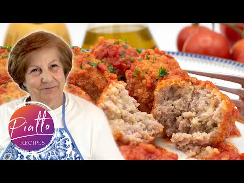 Italian Grandma Cooking Meatballs in Tomato Sauce