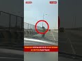 Dangerous driving with kid in a twowheeler on 100 feet road flyover