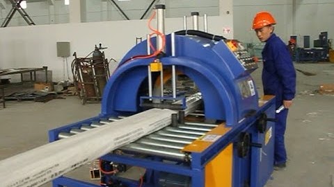 Horizontal orbital stretch wrapper and wrapping machine for wooden