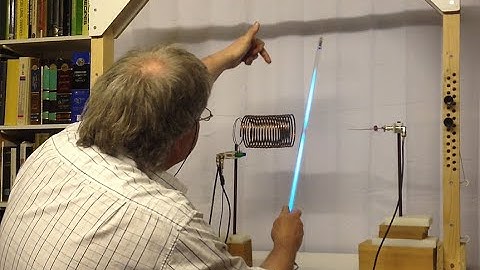 Self-resonating inductor. Using a gas discharge tube to show the EM field around the coil.