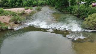 The beauty of a river lies in its graceful flow, reflecting the sunlight like a shimmering ribbon,