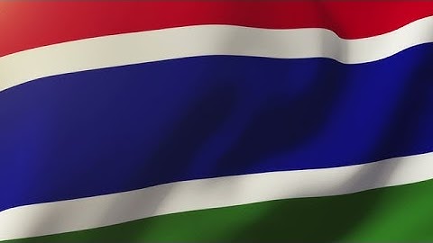 Gambia Flag Waving In The Wind. Looping Sun Rises Style. Animation Loop Stock Animation