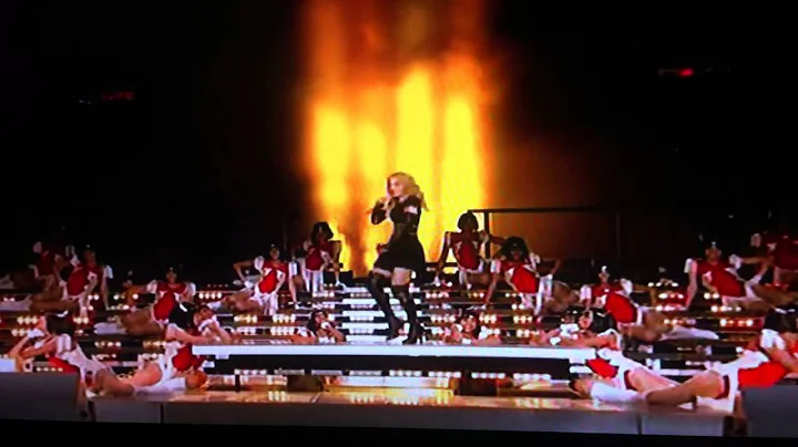 Maddona at super bowl 2012 - Mia shows her middler...
