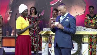 Bishop Ben Of Jcm Gives 15,000 And A Bale Of Clothes To This Mukurinu Woman