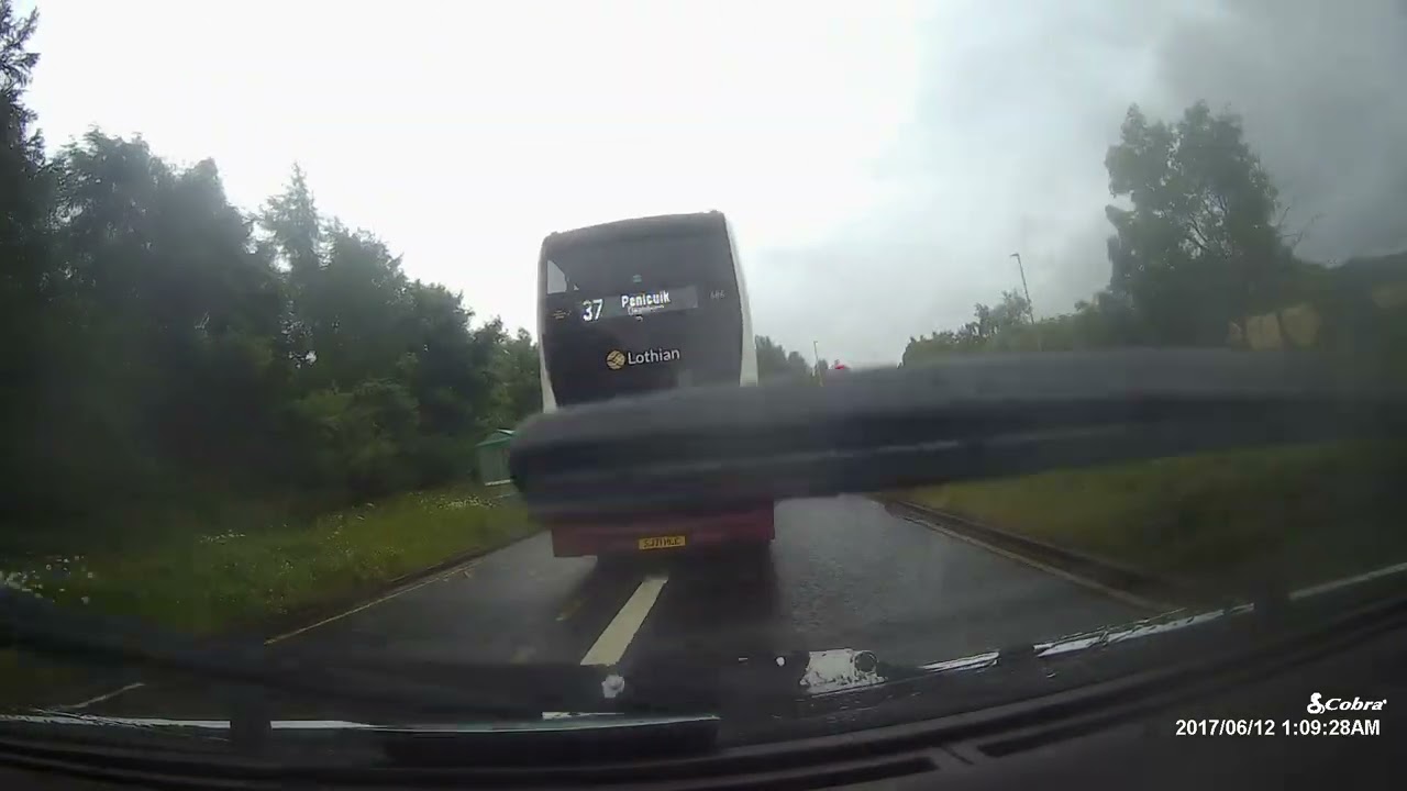 Bus Stradles Both Lanes Determined Not to Let Anyone Pass