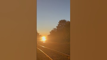 NS 7566 ES44DC leads NS 18G through Piscataway,NJ with a friendly horn salute & lantern show