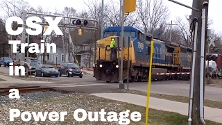 CSX Train in a City Power Outage: Employee Powers Crossing With Generator Conductor Uses Road Flares