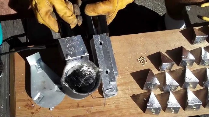 Making lead fishing weights in wooden molds 