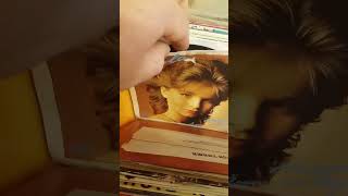 Flipping through a box with 45s
