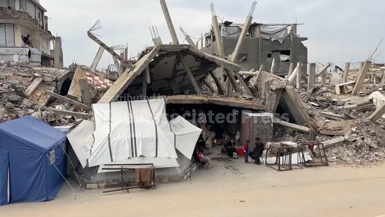 In a near-destroyed area of northern Gaza, families rely on firewood for cooking
