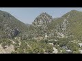 D-Log M. Cakallar, Alanya, Turkey. Aerial drone view of Alara Castle on hilltop overlooking Alara...