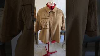 Embroidery of calligraphy on a custom-designed, relaxed-fit garment made from natural bamboo fabric.