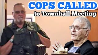 COPS CALLED TO TOWN HALL MEETING
