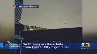 BASE Jumpers Parachute From Center City Skyscrapers