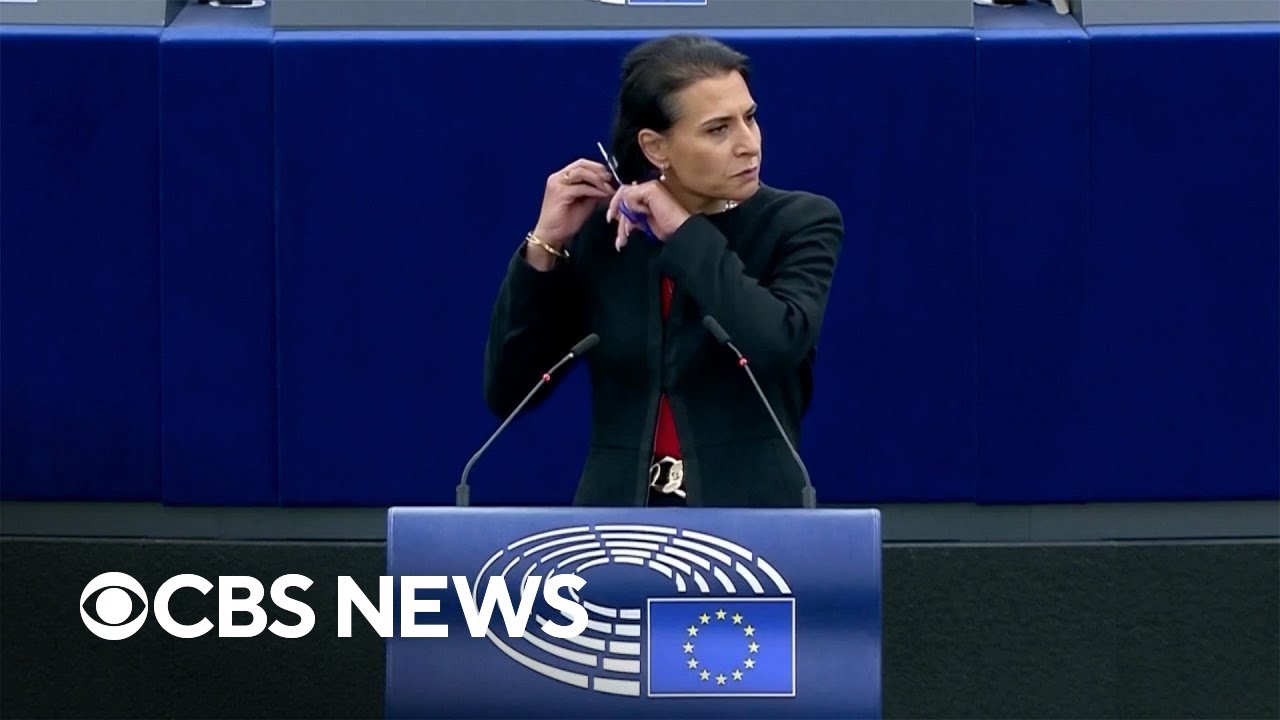 Lawmaker cuts hair at podium during European Union debate on Iran protests