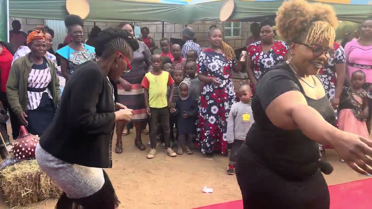 Switmaggy dancing with kamba ladies during a ngone mwaitu event in matuu