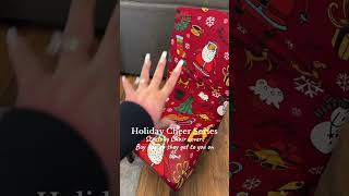 Stretchy chair covers in a Christmas print with Santa on them