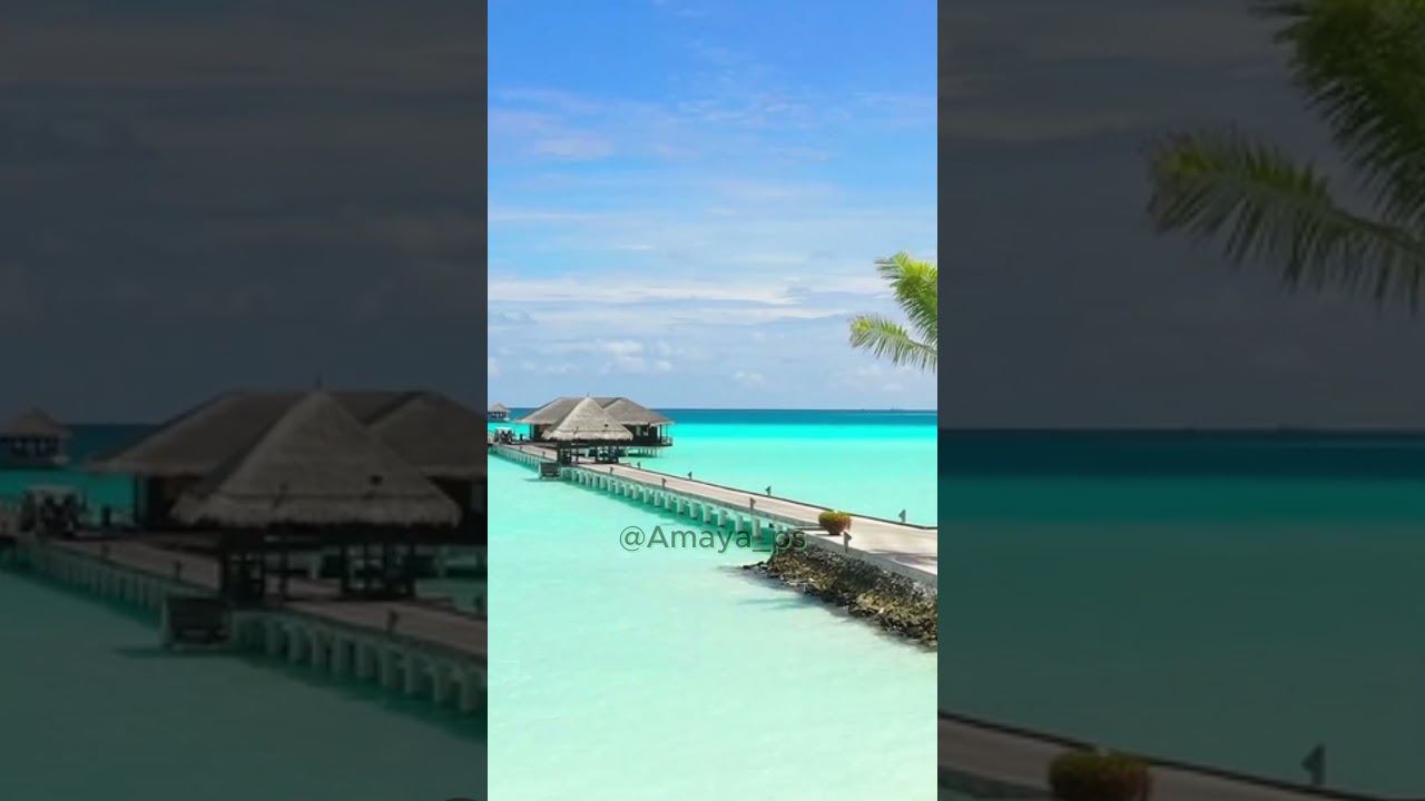 Paradise Beach with Teal Water & Long Pier with Cabins