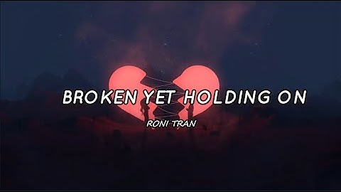 🎵RONI TRAN - BROKEN YET HOLDING ON (Lyrics)  #RnB #MusikaNiYan