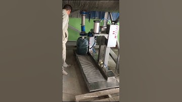 Single nozzle stone paint paste big barrel bucket pail tank weighing filling machine filling video