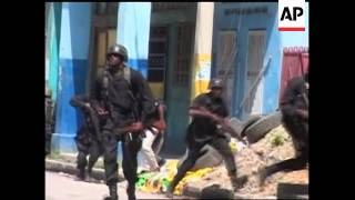 Violence breaks out at pro-Aristide demo