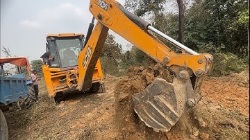 A Skilled Operator Is Loading Soil Into A Tractor By Machine @droneplanet2040