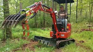 GroundHog BH14G-2 Mini Excavator Clearing Trails With a Rake.