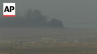 Smoke billows over Gaza as efforts to deliver desperately needed aid appear to falter